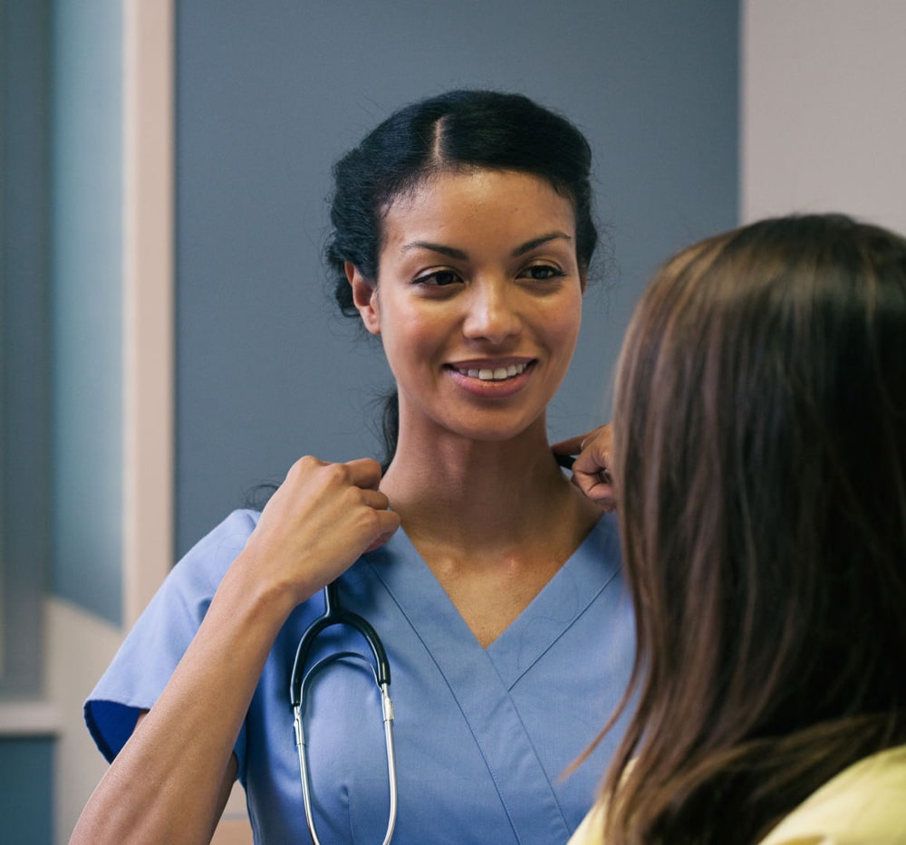 A clinician and patient discussing how much an abortion costs. A clinician and patient discussing how much an abortion costs.